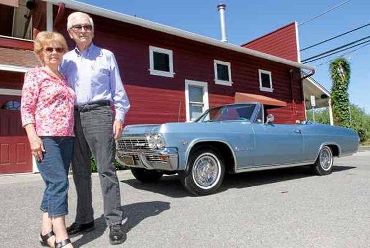 Charlie and Loretta Carroll of Chico stand with their 1965 Chevy Impala that will be on the May 24 episode of the TV show Car Hunters.