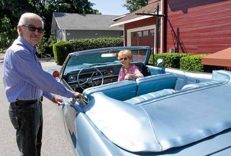 Charlie and Loretta Carroll of Chico stand with their robin-egg blue 1965 Chevy Impala that will be on the History Channels show Car Hunters.